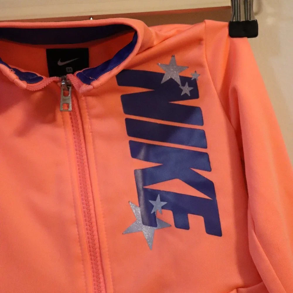 Nike Pink Zip-up Sweatshirt 2T, pink with blue writing & stars, ruffle bottom